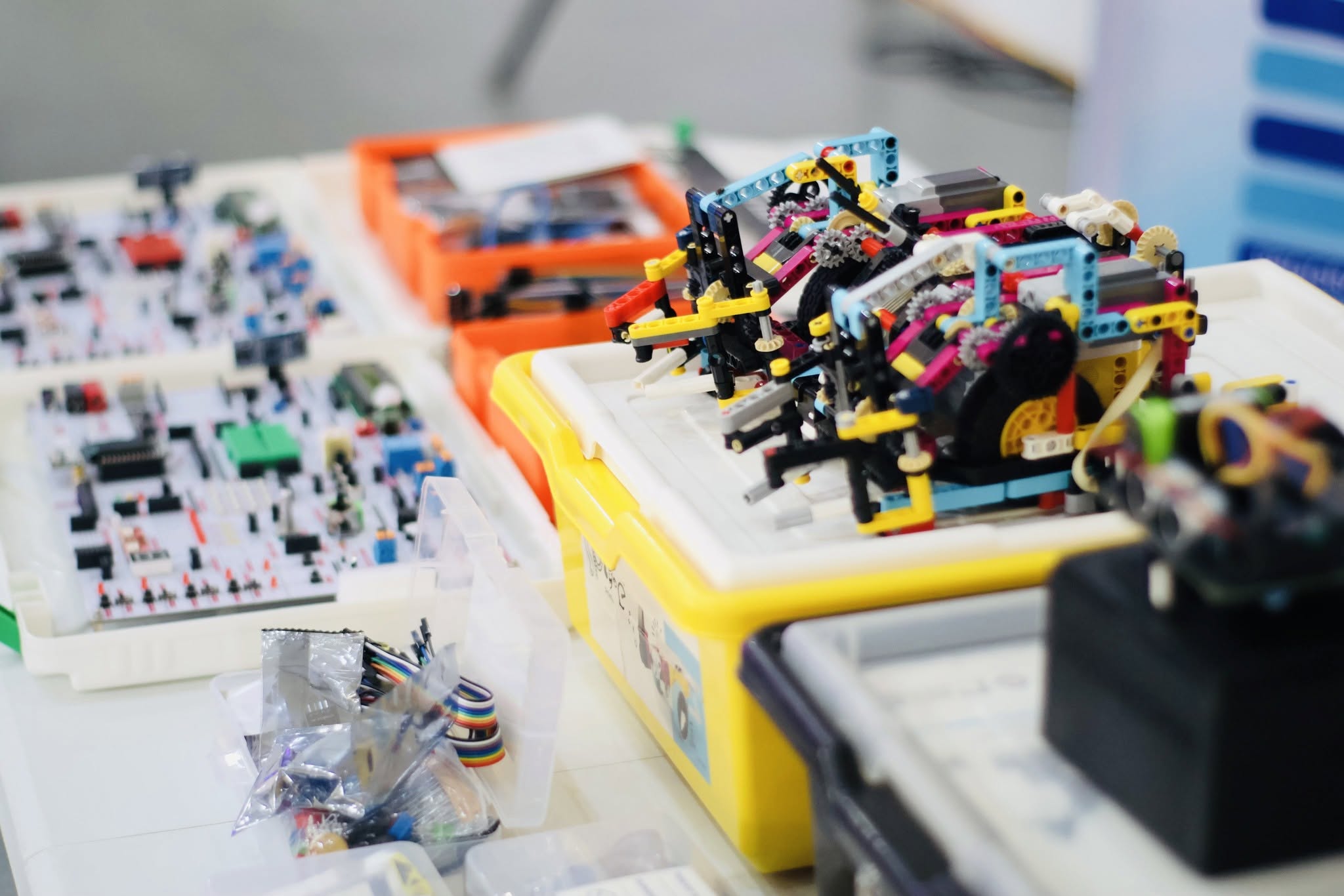 Robotics kits and a training arm set up for a hands-on A+SDC session
